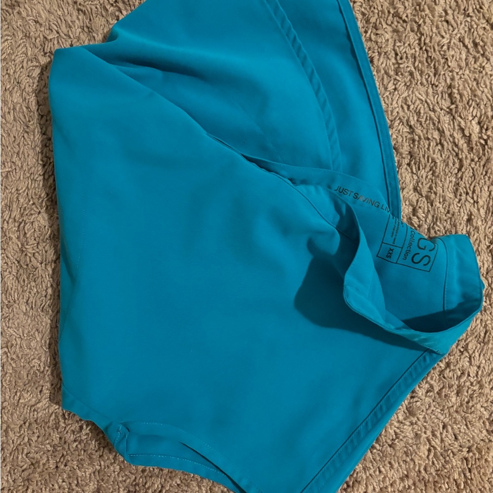Teal XXS over sized top. New without tags. $15